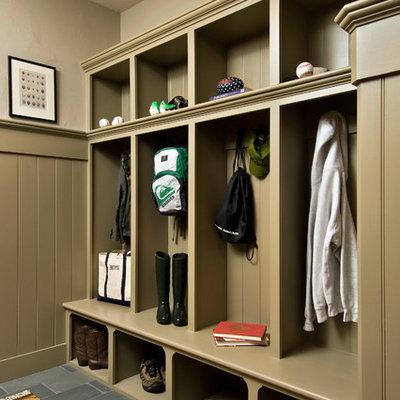Example of a mountain style slate floor and gray floor hallway design in New York with beige walls