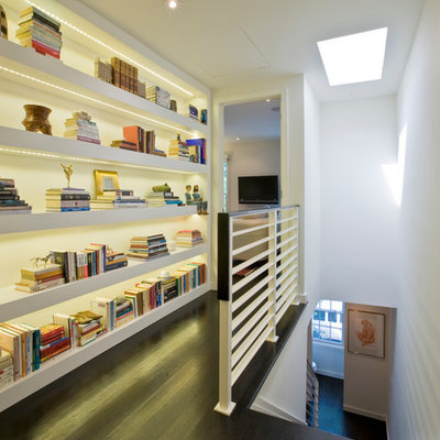 Inspiration for a contemporary dark wood floor hallway remodel in DC Metro with white walls