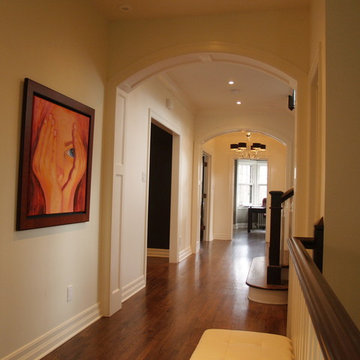 Arched Paneled Passage Way / Custom Built in Cabinetry / Coffered Ceiling
