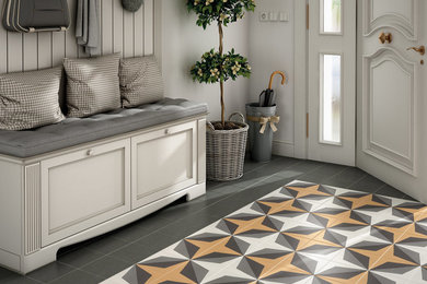 Example of a danish porcelain tile and yellow floor hallway design
