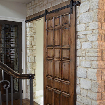 Barn Wood Sliding Door accented with Weston Cream Natural Stone