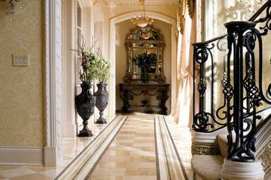 Huge tuscan marble floor and multicolored floor hallway photo in San Francisco with beige walls
