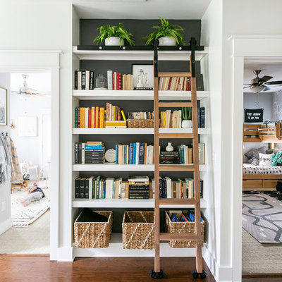 Hallway - medium tone wood floor and brown floor hallway idea in Charleston with white walls