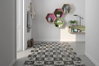 Example of an ornate porcelain tile and multicolored floor hallway design in Other