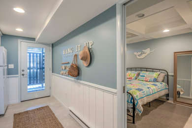 Example of a mid-sized beach style hallway design in Other with gray walls