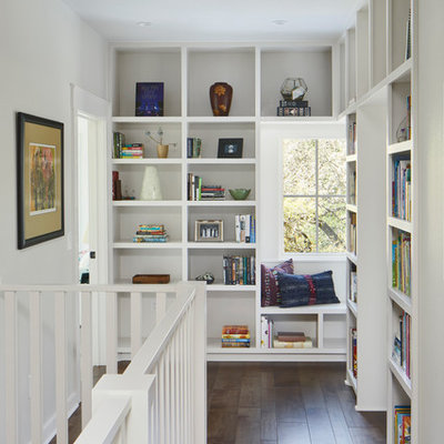 Hallway - mid-sized transitional brown floor and dark wood floor hallway idea in Austin with white walls