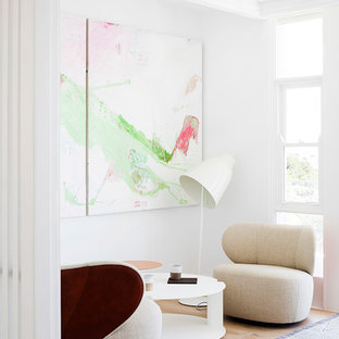 Photo of a contemporary hallway in Sydney with white walls, light hardwood floors and brown floor.