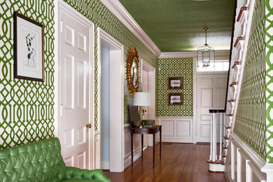 Inspiration for a mid-sized eclectic medium tone wood floor hallway remodel in Raleigh with multicolored walls