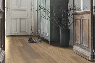 Country dark wood floor and brown floor hallway photo in Other