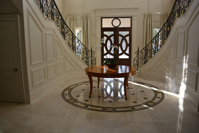 Crema Marfil MARBLE tiles, stairs, countertops and fireplace in mansion