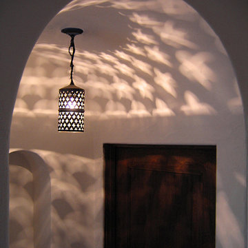 Deco Lighting in a Small Barrel Hallway in Spanish home