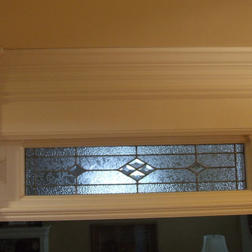 Doorway trim with glass transom