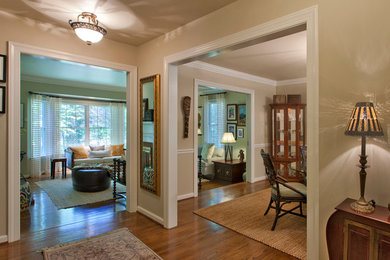 Example of a small eclectic medium tone wood floor and brown floor hallway design in DC Metro with gray walls
