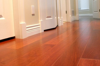 Hallway - mid-sized craftsman dark wood floor and brown floor hallway idea in Vancouver with beige walls