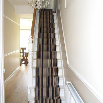 engineered oak hall floor with striped stair carpet runner