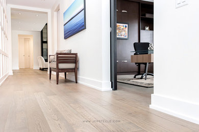Inspiration for a modern light wood floor hallway remodel in Vancouver