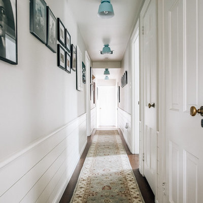 Inspiration for a country dark wood floor and brown floor hallway remodel in San Francisco with gray walls