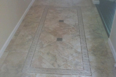 Inspiration for a slate floor hallway remodel in Orlando with beige walls