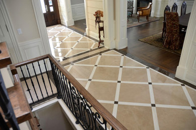 Inspiration for a large victorian marble floor and beige floor hallway remodel in Toronto with beige walls