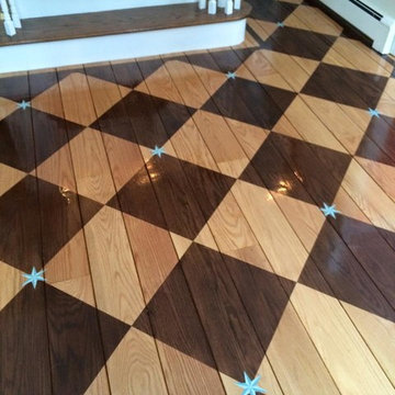Foyer with checkerboard stained floor with hand painted blue accent stars