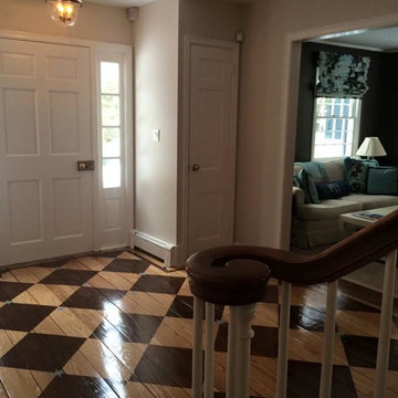 Foyer with checkerboard stained floor with hand painted blue accent stars