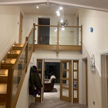 Galleried glass and oak staircase