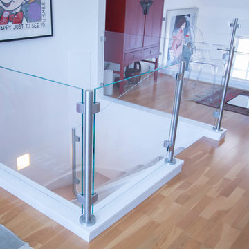 Glass Balustrade to the existing stairs,top landing and mezzanine floor.
