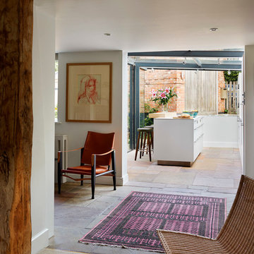 Glass box extension on thatched cottage