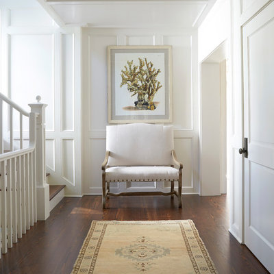 Hallway - coastal medium tone wood floor and brown floor hallway idea in Other with white walls