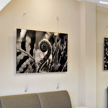Gyford Wire Suspension and edge grips hanging large-print photos.