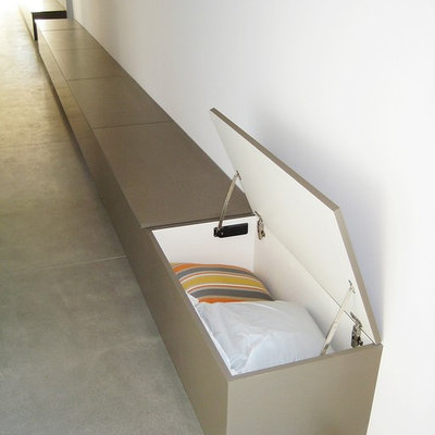Inspiration for a large modern concrete floor hallway remodel in Los Angeles with white walls