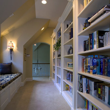 Hallway with built-in bookcases and built-in window seat