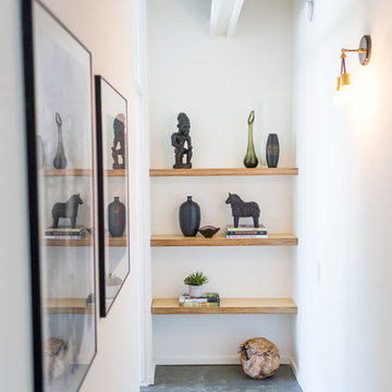 Hallway with Built-in Shelves, African Statue, Horse