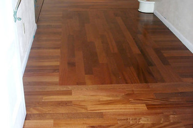 Hallway - medium tone wood floor hallway idea in Tampa