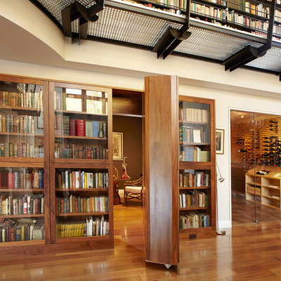 Inspiration for a huge contemporary medium tone wood floor and brown floor hallway remodel in New York with beige walls
