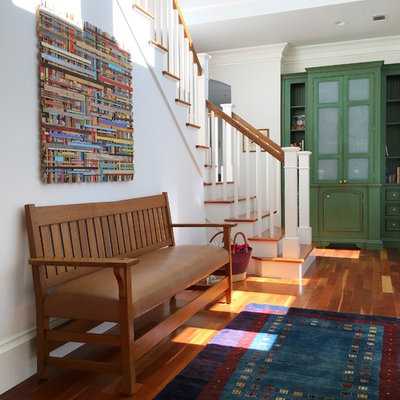 Inspiration for a transitional medium tone wood floor and brown floor hallway remodel in Atlanta with white walls