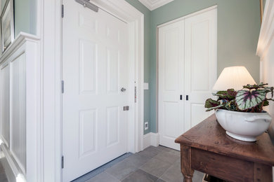 Example of a mid-sized classic hallway design in Boston with green walls