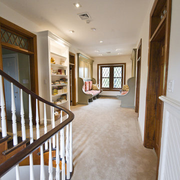 Inglenook benches turn hallway into children's reading room.