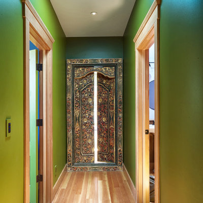 Hallway - cottage light wood floor hallway idea in San Francisco with green walls