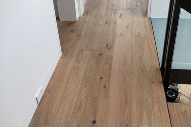 Inspiration for a modern medium tone wood floor hallway remodel in San Francisco