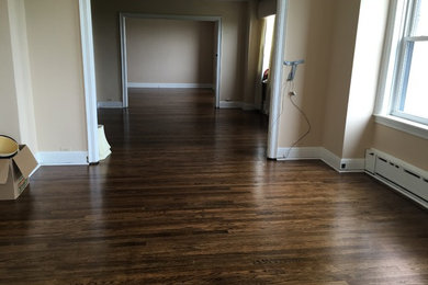 Hallway - large traditional dark wood floor and brown floor hallway idea in Chicago with beige walls