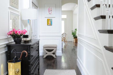 Hallway - large traditional dark wood floor hallway idea in Vancouver with white walls