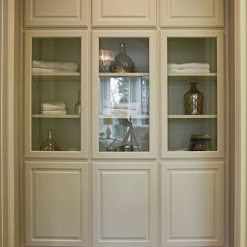 Linen closet cabinets with glass doors