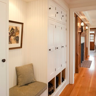 This is an example of a large traditional hallway in Seattle with medium hardwood floors and white walls.