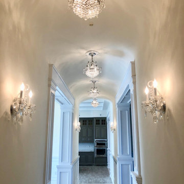 Luxury Hallway with mini chandeliers and sconces