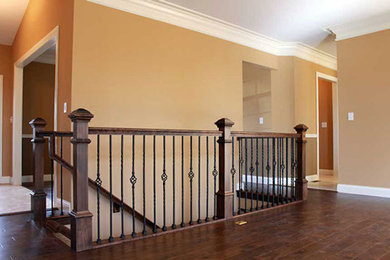 Inspiration for a contemporary medium tone wood floor hallway remodel in St Louis with beige walls