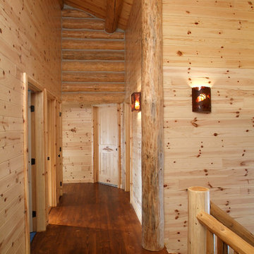 Majestic hallway with WoodHaven knotty pine paneling, doors and trim