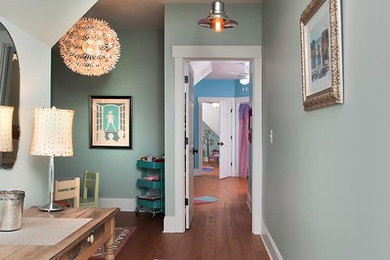 Inspiration for a timeless medium tone wood floor hallway remodel in Atlanta with blue walls