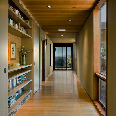Hallway - large contemporary medium tone wood floor and beige floor hallway idea in San Francisco with beige walls