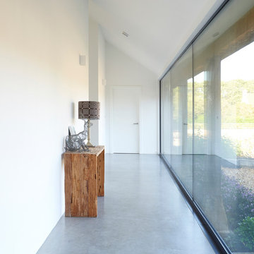 Minimalist glazed hallway - Contemporary Barn Conversion in Wiltshire